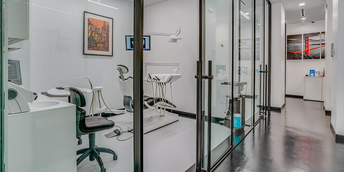 General Dentistry smiling young woman in exam room