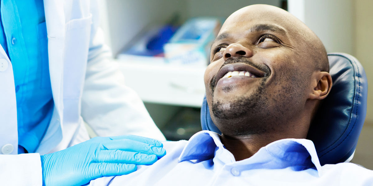 Restorative Dentistry - Smiling Man in Dental Chair